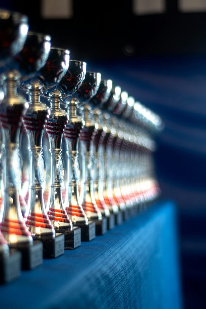 a-row-of-wine-glasses-sitting-on-top-of-a-table-qk8r17bt5fy a-row-of-wine-glasses-sitting-on-top-of-a-table-qk8r17bt5fy